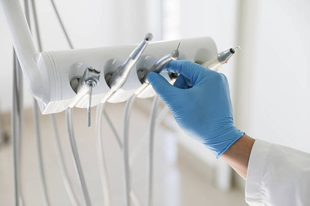 Professional Tooth Extraction technician working in Genoa, IL